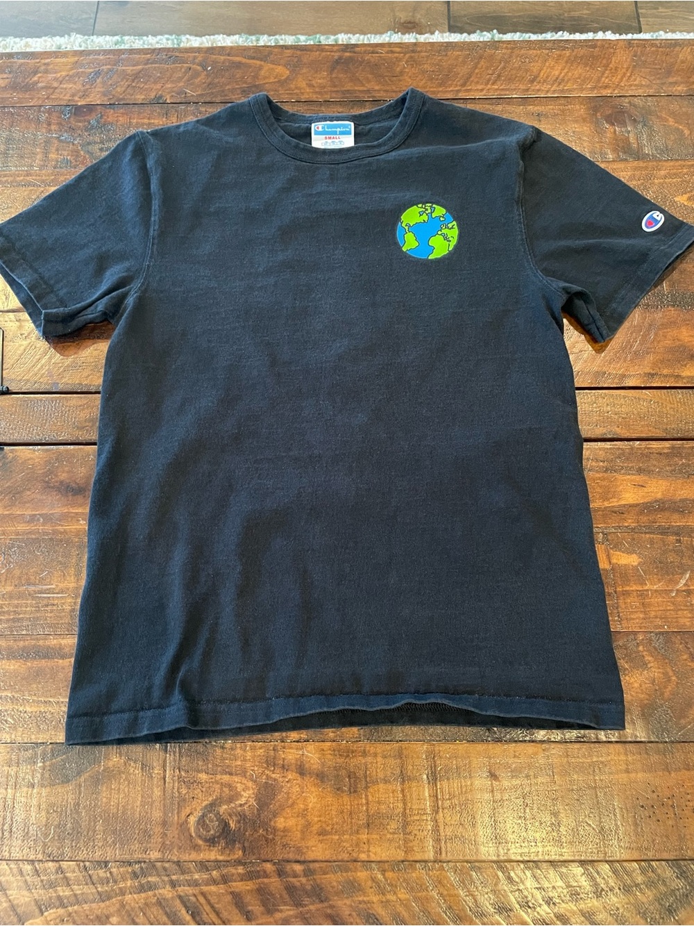 Champion Black Tee with Alien Design on back.
